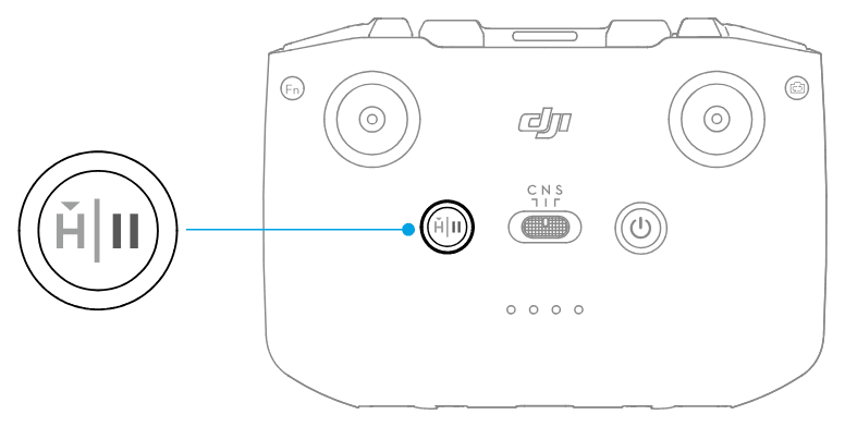 Knappen Flight Pause/RTH på DJI RC-N3 sitter mellan styrspakarna, till vänster om flyglägesomkopplaren.