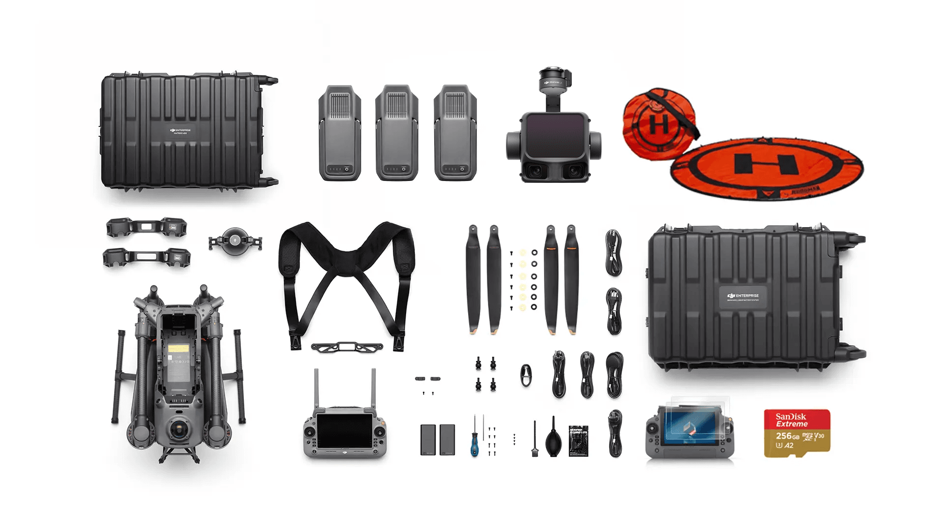 En omfattande drönarutrustning med drönare, Zenmuse L3 LiDAR, batterier, propellrar, fjärrkontroll, landningsplatta och tillbehör, organiserade på en vit bakgrund.